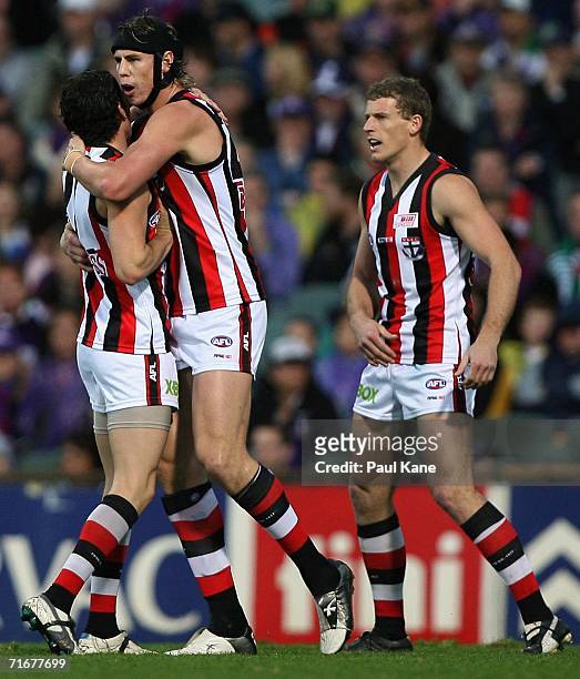 Leigh Montagna and Justin Koschitzke of the Saints celebrate a goal during the round 20 AFL match between the Fremantle Dockers and the St Kilda...