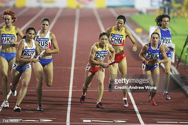 Athletes from Russia, China and France hand over batons during a heat of the women's 4X400 meters relay at the 11th IAAF World Junior Athletics...