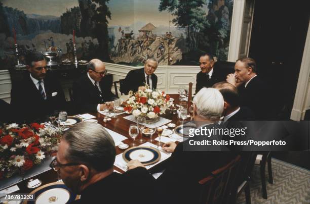 President of the United States Lyndon B Johnson 4th from left, entertains Prime Minister of the United Kingdom Harold Wilson , 3rd from left, and...