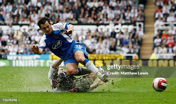 Stephen Carr of Newcastle tackles Leighton Baines of Wigan during the Barclays Premiership match between Newcastle United and Wigan Athletic at...