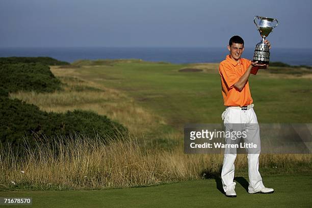 Matthew Nixon of England lifts the trophy after beating Bjorn Akesson of Sweden on the 38th hole during the finals of The Boys Amateur Championship...