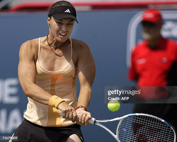 Martina Hingis of Switzerland hits a backhand on her way to a 6-3, 3-1 semifinal win over Anna Chakvetadze of Russia at the Rogers Cup women's tennis...