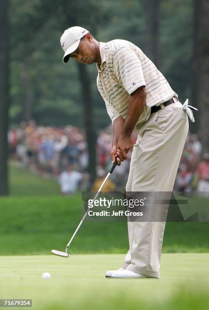 Tiger Woods putts on the seventh green during the third round of the 2006 PGA Championship at Medinah Country Club on August 19, 2006 in Medinah,...