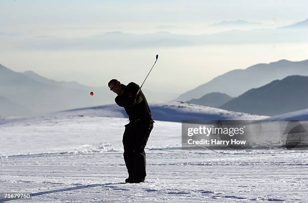 Cesar Serrano hits a chip shot on his way to victory during the Chivas Snow Golf Championship at La Parva Ski Resort on August 19, 2006 in Santiago,...