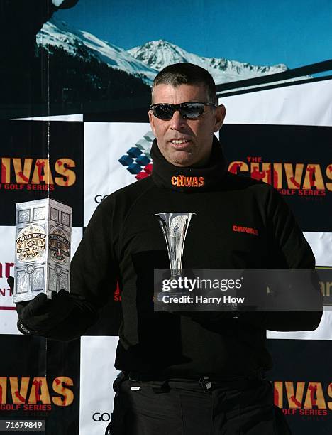 Victor Serrano poses with tophy after his win during the Chivas Snow Golf Championship at La Parva Ski Resort on August 19, 2006 in Santiago, Chile.