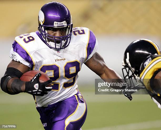 Chester Taylor of the Minnesota Vikings looks to avoid the tackle of Ike Tayler of the Pittsburgh Steelers during a pre-season game on August 19,...