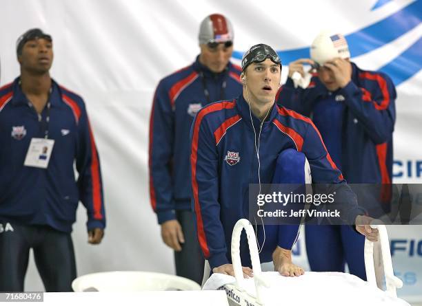 Michael Phelps of the USA stands in front of his teammates Cullen Jones, Jason Lezak and Neil Walker as he prepares to start the Men's 4 x 100m...