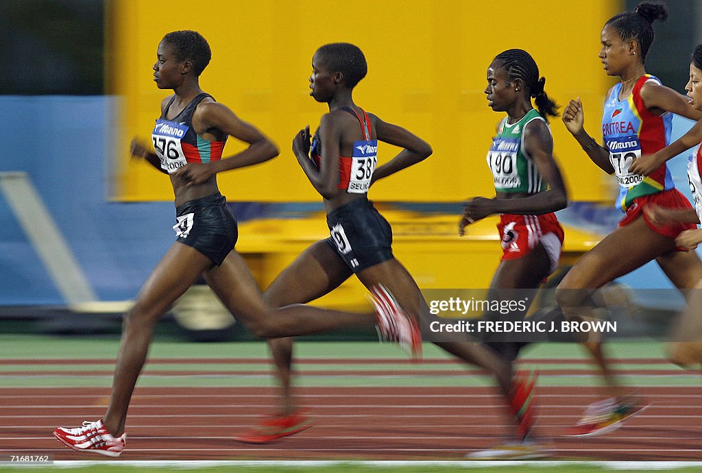 Kenya's Irene Jelagat (L-#376) leads her