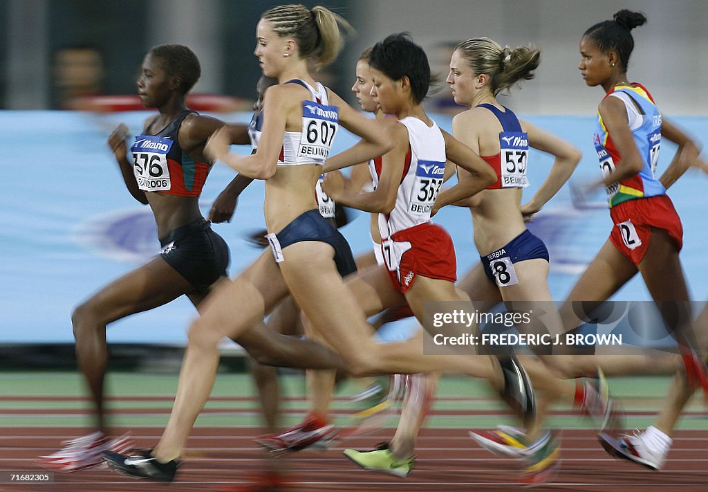 Kenya's Irene Jelagat (L/#376) leads her
