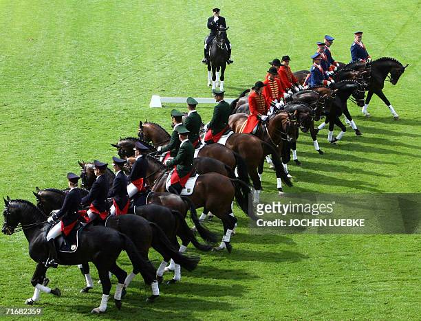 Riders in historic costumes and their horses from German studs perform a quadrille during the opening day of the FEI World Equestrian Games 20 August...