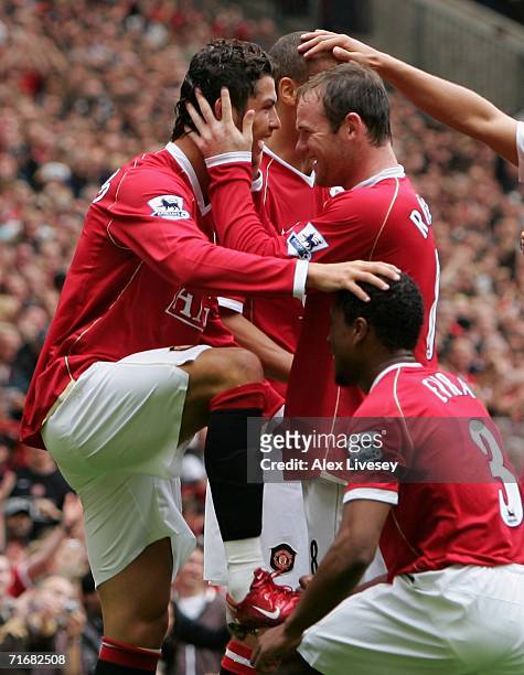 Cristiano Ronaldo of Manchester United celebrates scoring his team's fourth goal with Wayne Rooney during the Barclays Premiership match between...