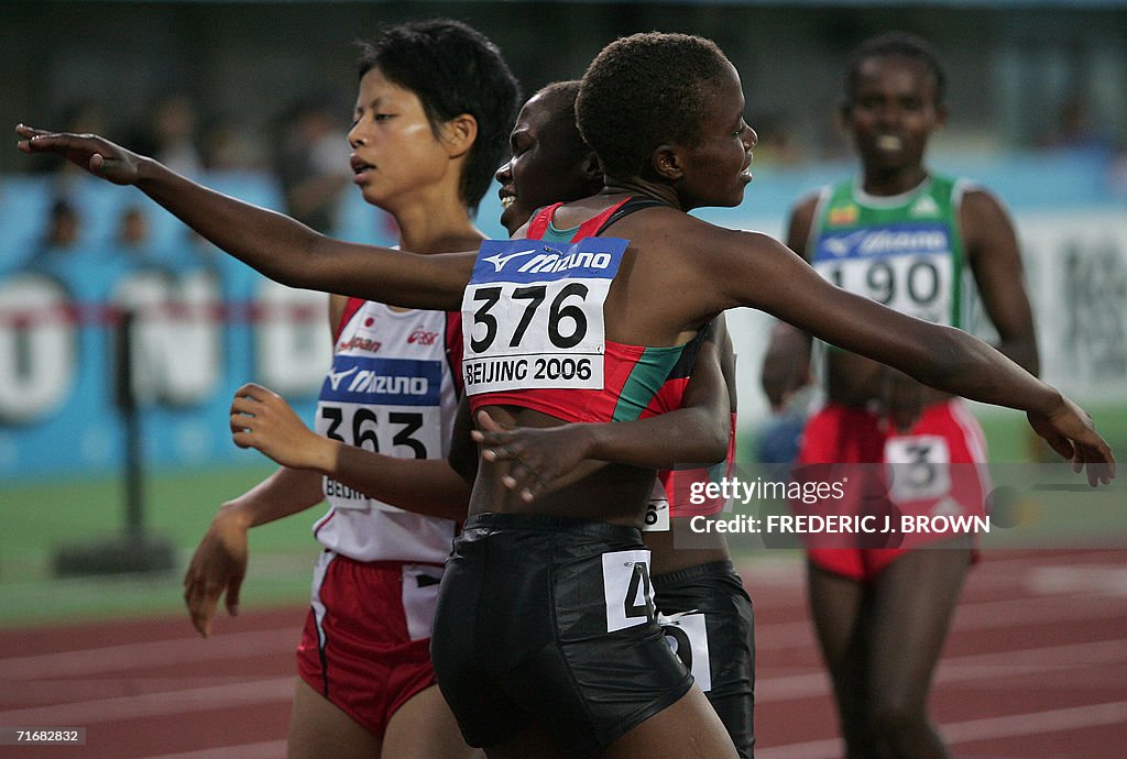 Kenya's Irene Jelagat (#376) embraces co