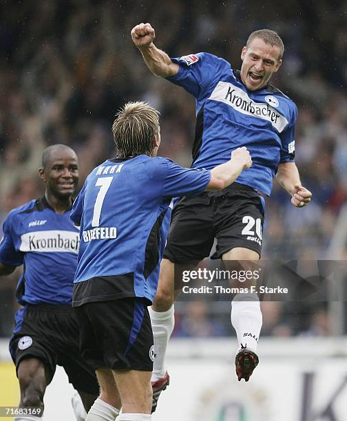 Marcio Borges , Thorben Marx and Joerg Boehme of Bielefeld celebrate during the Bundesliga match between Arminia Bielefeld and VFB Stuttgart at the...