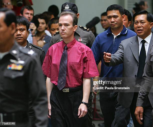 American John Mark Karr is led by Thai police from the immigration detention facility to the airport to depart for the U.S. August 20, 2006 in...