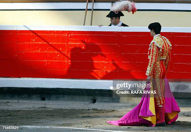 Spanish matador Miguel Angel Perera looks at his picador fighting a Marques de Domecq bull during the second corrida of the Aste Nagusia festivities,...