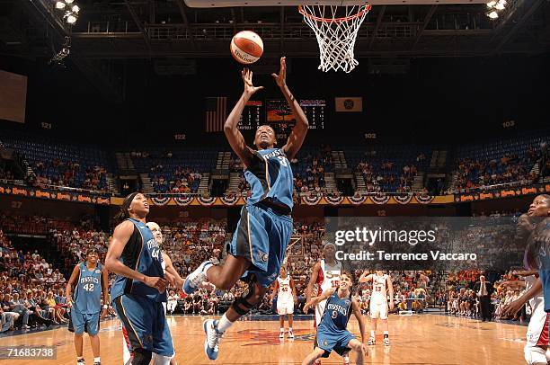 DeLisha Milton-Jones of the Washington Mystics goes to the basket against the Connecticut Sun in game two of the Eastern Conference Semifinals during...