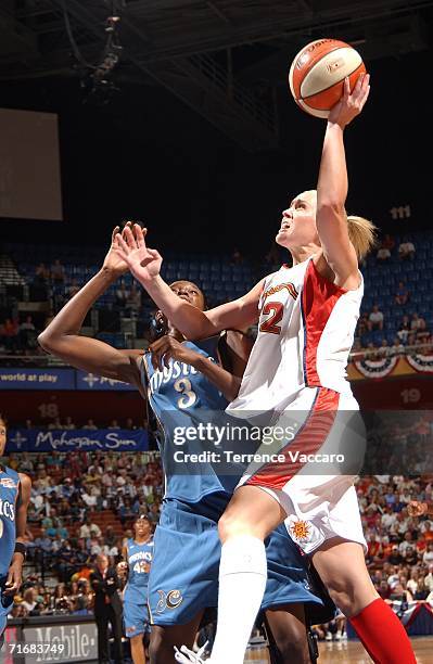 Katie Douglas of the Connecticut Sun shoots against Delisha Milton-Jones of the Washington Mystics in game two of the Eastern Conference Semifinals...