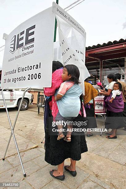 San Juan Chamula, MEXICO: A Tzotzil native casts her ballot during Chiapas' state election in San Juan Chamula, Mexico, on August 20th, 2006. In the...