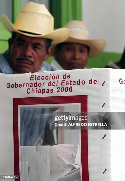 San Juan Chamula, MEXICO: Tzotzil natives wait to cast their ballots during Chiapas' state election in San Juan Chamula, Mexico, on August 20th,...