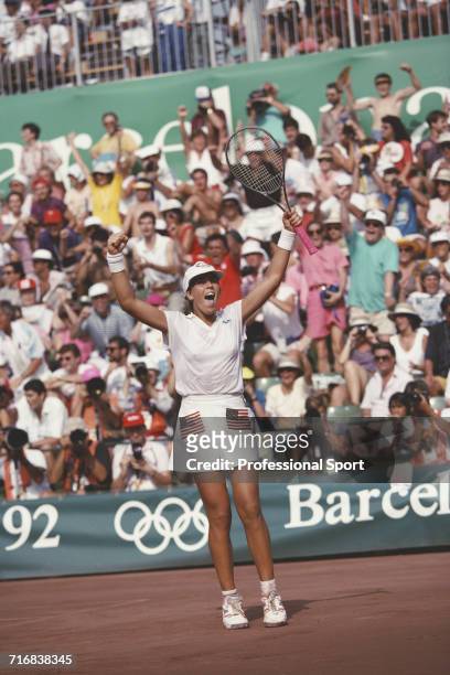 American tennis player Jennifer Capriati of the United States team pictured celebrating after beating Steffi Graf of Germany in the final to win the...