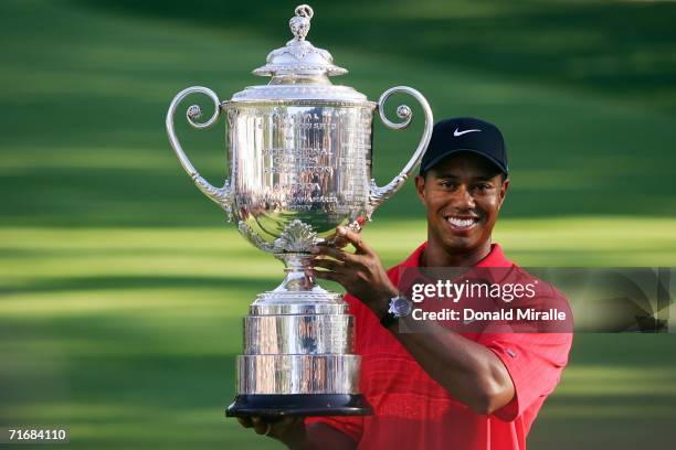 Tiger Woods holds the Wanamaker Trophy after winning the 2006 PGA Championship at Medinah Country Club on August 20, 2006 in Medinah, Illinois.