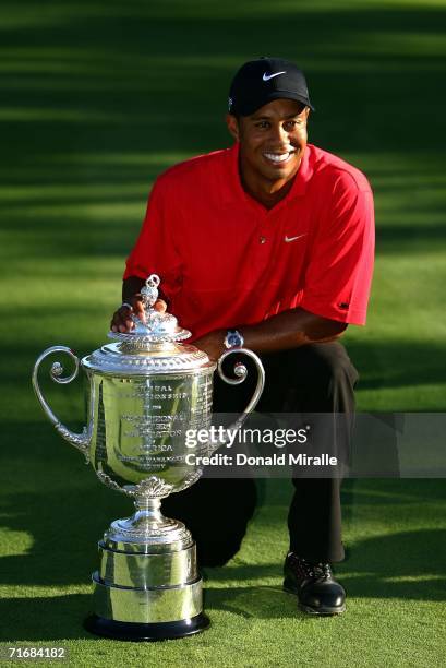 Tiger Woods poses with the Wanamaker Trophy after winning the 2006 PGA Championship at Medinah Country Club on August 20, 2006 in Medinah, Illinois.
