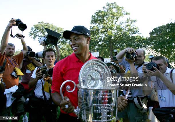 Tiger Woods holds the Wanamaker Trophy after winning the 2006 PGA Championship at Medinah Country Club on August 20, 2006 in Medinah, Illinois.