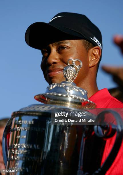 Tiger Woods holds the Wanamaker Trophy after winning the 2006 PGA Championship at Medinah Country Club on August 20, 2006 in Medinah, Illinois.