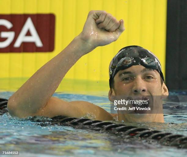 Michael Phelps of the USA celebrates his first place finish after setting a new world record of 1 minute, 55.84 in the Men's 200m Individual Medley...