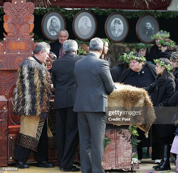 Mourners and the new Maori King Tuheitia Paki farewell the coffin of Maori Queen Dame Te Atairangikaahu at Turangawaeware Marae on August 21, 2006 in...