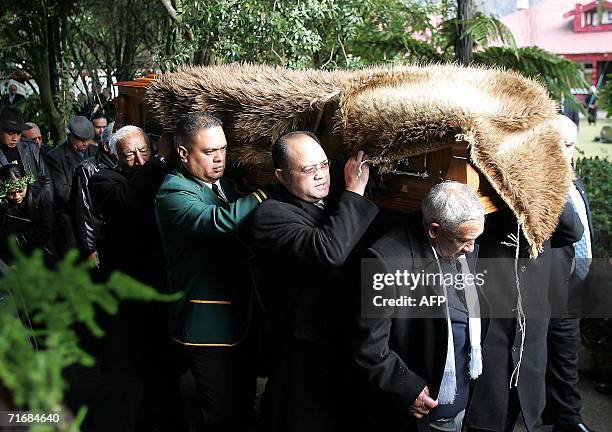 Maori Queen Te Arikinui Dame Te Atairangikaahu's feather-draped coffin is carried during the funeral service at Turangawaewae in Ngaruawahia, south...