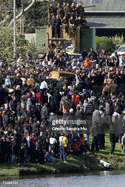 New Zealand soldiers watch the coffin carrying the late Queen Dame Te Atairangikaahu from the top of their truck as she is farewelled from the...