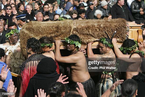 The coffin of the Maori Queen, Dame Te Atairangikaahu is lifted by pallbearers towards her final resting place on top of the sacred Taupiri Mountain...