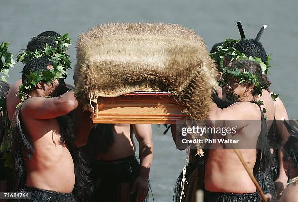 The coffin of the Maori Queen, Dame Te Atairangikaahu is lifted by pallbearers towards her final resting place on top of the sacred Taupiri Mountain...