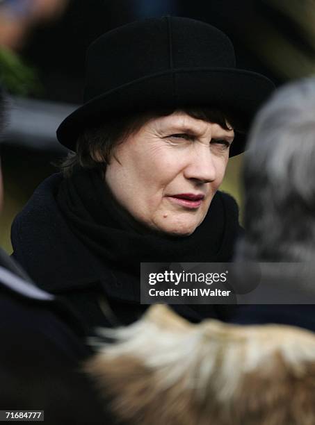 Prime Minister Helen Clark waits for the coffin of the Maori Queen Dame Te Atairangikaahu following its journey down the Waikato River, August 21,...