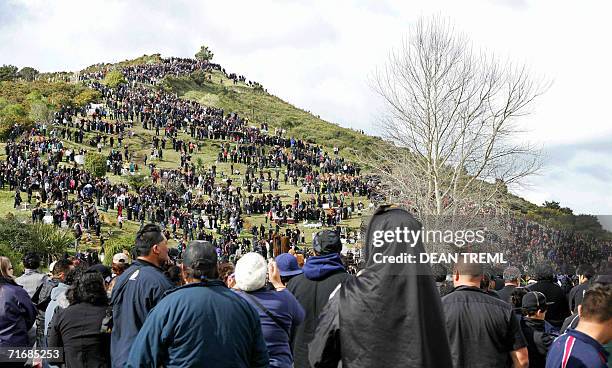 Crowds of onlookers wait for Maori Warriors and attendants to escort the coffin of Queen Te Arikinui Dame Te Atairangikaahu during her burial...