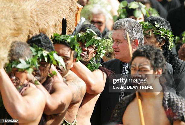 Maori King, Tuheitia Paki looks at the feather-draped coffin of his mother Queen Te Arikinui Dame Te Atairangikaahu as Maori Warriors carry to her...