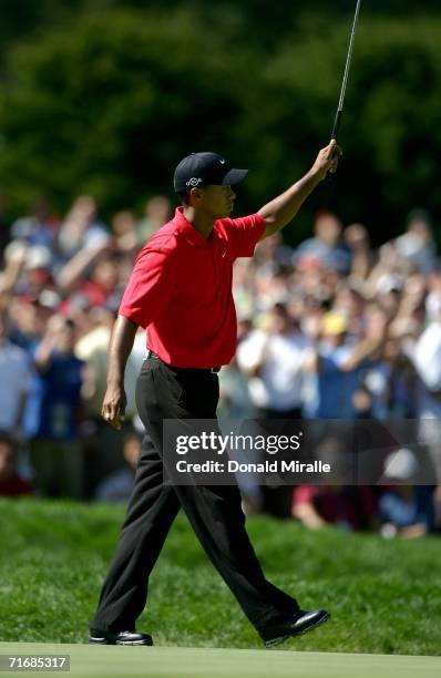 Tiger Woods celebrates his birdie putt on the sixth hole during the final round of the 2006 PGA Championship at Medinah Country Club on August 20,...