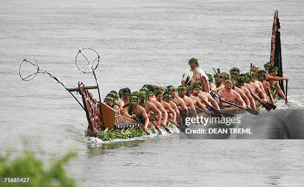 Crew of Maori Warriors row a waka on the Waikato river escorting the coffin of Queen Te Arikinui Dame Te Atairangikaahu toward Mount Taupiri to her...