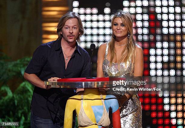 Actor David Spade and Carmen Electra presents the award for Choice Comedian onstage at the 8th Annual Teen Choice Awards at the Gibson Amphitheatre...