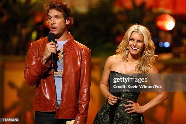 Hosts Dane Cook and Jessica Simpson onstage at the 8th Annual Teen Choice Awards at the Gibson Amphitheatre on August 20, 2006 in Universal City,...
