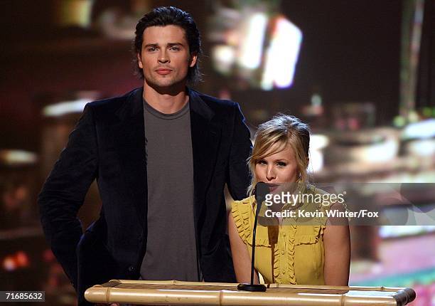 Actor Tom Welling and Actress Kristen Bell present the award for Choice Movie Actor in a Drama/Action Adventure movie onstage at the 8th Annual Teen...