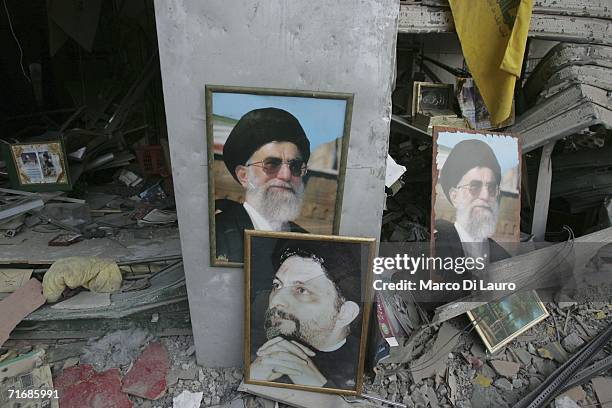 Posters of Ayatollah Ali Khamenei stand on August 21, 2006 in the southern suburb of Haret Hreik in Beirut, Lebanon. Many Lebanese are coming to the...