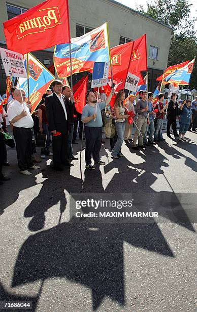 Moscow, RUSSIAN FEDERATION: Members of the nationalist Rodina Party hold flags and posters at a demonstration in front of the Estonian Embassy in...