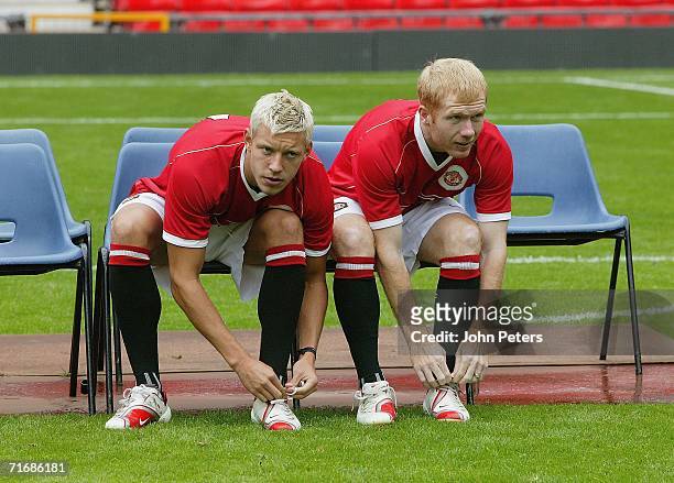 Alan Smith and Paul Scholes of Manchester United takes part in the official Manchester United team photocall at Old Trafford on August 21 2006 in...