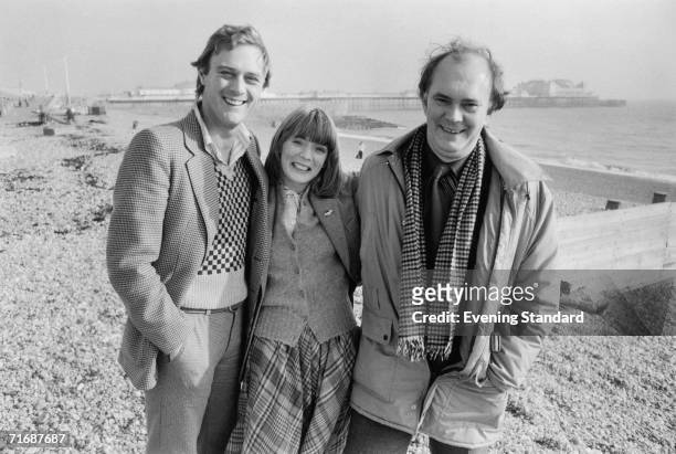 From left to right, actors Christopher Cazenove and Alison Steadman, and English playwright Alan Ayckbourn on the beach at Brighton, 1979.