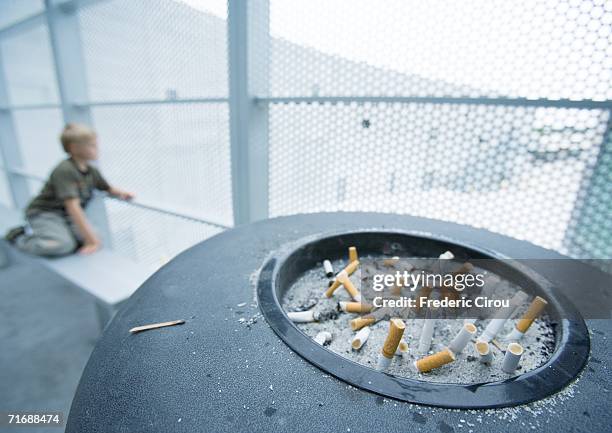 boy in smoking area - ashtray stock pictures, royalty-free photos & images