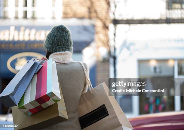 shopper with shopping bags - kaufsucht stock-fotos und bilder