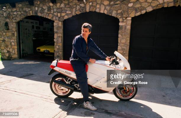 Comedian and talk show host Jay Leno poses with his motocycle during a 1989 Beverly Hills, California, photo portrait session. Host of the "Tonight...