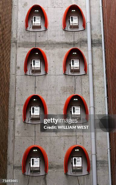 Phone boxs are attached high on awall as an art installation to brighten up laneways in central Melbourne, 22 August 2006. The Australian cabinet met...